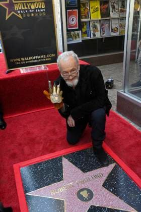 American actor and director Robert Englund, who is best known for his portrayal of the villainous Freddie Krueger kneels next to his star during an unveiling ceremony honoring him with the 2, 826th star on the Hollywood Walk of Fame in Los Angeles on Friday, October 31, 2025.  LAP20251031131 JIMxRUYMEN