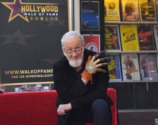 American actor and director Robert Englund, who is best known for his portrayal of the villainous Freddie Krueger kneels next to his star during an unveiling ceremony honoring him with the 2, 826th star on the Hollywood Walk of Fame in Los Angeles on Friday, October 31, 2025.  LAP2025103113 JIMxRUYMEN