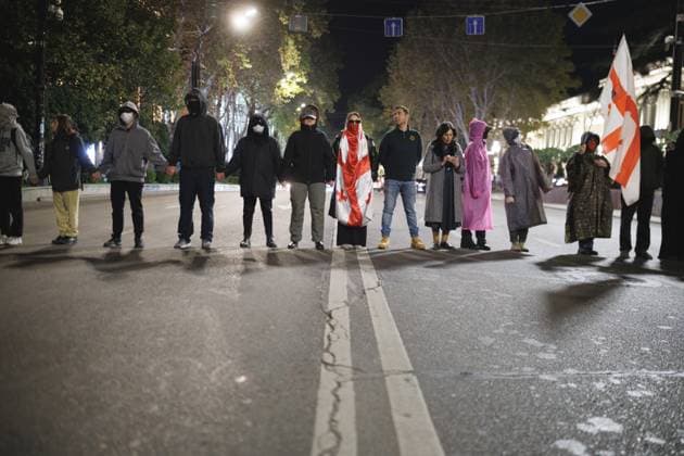 338th Day Of Continuous Protest. On October 31, 2025, in Tbilisi, Georgia, protesters attempt to block Rustaveli Avenue during a demonstration demanding the release of political prisoners and new elections. Police clear the road and reopen it to traffic after about 30 minutes, and later that evening arrest at least two people for obstructing the road. Tbilisi Georgia  Copyright: xSÃ bastienxCanaudx originalFilename: canaud-notitle251101_np0Df.jpg