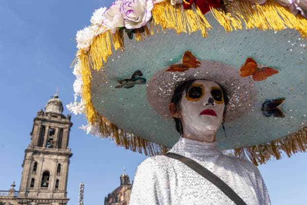 Day Of The Dead In Mexico City s Historic Center A participant with skull face paint and a traditional costume is seen during the Day of the Dead celebration in the Zocalo, the historic center of Mexico City, Mexico. Day of the Dead honors deceased loved ones with altars, marigolds, skull face paint, and offerings meant to guide returning spirits. The Zocalo, officially Plaza de la Constitucion, is Mexico City s main square and serves as the political and cultural heart of the capital since Aztec times. Mexico City Mexico Mexico  Copyright: xRonenxTivonyx originalFilename: tivony-dayofthe251031_npDp2.jpg