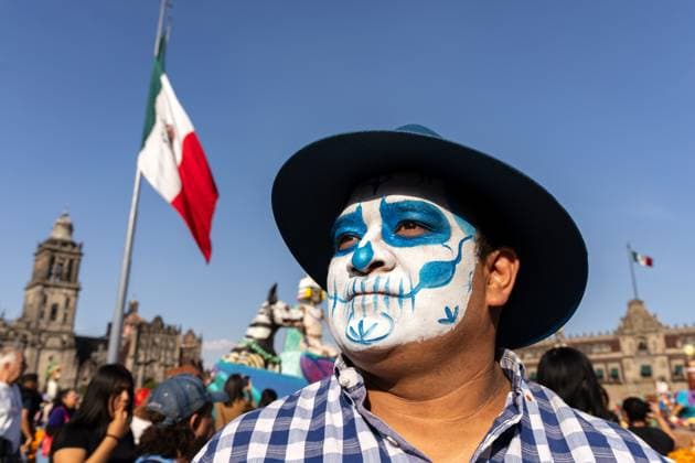 Day Of The Dead In Mexico City s Historic Center A participant with skull face paint is seen during the Day of the Dead celebration in the Zocalo, the historic center of Mexico City, Mexico. Day of the Dead honors deceased loved ones with altars, marigolds, skull face paint, and offerings meant to guide returning spirits. The Zocalo, officially Plaza de la Constitucion, is Mexico City s main square and serves as the political and cultural heart of the capital since Aztec times. Mexico City Mexico Mexico  Copyright: xRonenxTivonyx originalFilename: tivony-dayofthe251031_npeDt.jpg
