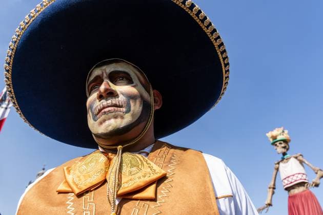Day Of The Dead In Mexico City s Historic Center A participant with paint and a traditional costume is seen during the Day of the Dead celebration in the Zocalo, the historic center of Mexico City, Mexico. Day of the Dead honors deceased loved ones with altars, marigolds, skull face paint, and offerings meant to guide returning spirits. The Zocalo, officially Plaza de la Constitucion, is Mexico City s main square and serves as the political and cultural heart of the capital since Aztec times. Mexico City Mexico Mexico  Copyright: xRonenxTivonyx originalFilename: tivony-dayofthe251031_npGZm.jpg