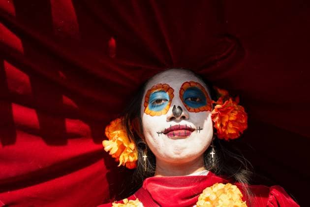 Day Of The Dead In Mexico City s Historic Center A woman dressed as La Catrina participates in the Day of the Dead celebration in the Zocalo, the historic center of Mexico City, Mexico. Day of the Dead honors deceased loved ones with altars, marigolds, skull face paint, and offerings meant to guide returning spirits. The Zocalo, officially Plaza de la Constitucion, is Mexico City s main square and serves as the political and cultural heart of the capital since Aztec times. Mexico City Mexico Mexico  Copyright: xRonenxTivonyx originalFilename: tivony-dayofthe251031_nphxj.jpg