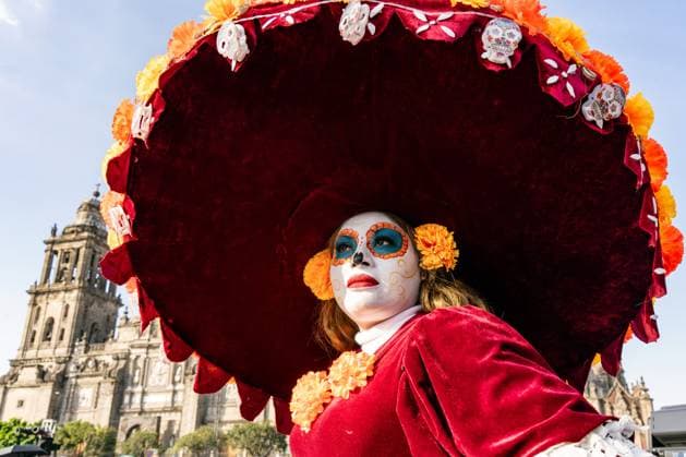 Day Of The Dead In Mexico City s Historic Center A woman dressed as La Catrina participates in the Day of the Dead celebration in the Zocalo, the historic center of Mexico City, Mexico. Day of the Dead honors deceased loved ones with altars, marigolds, skull face paint, and offerings meant to guide returning spirits. The Zocalo, officially Plaza de la Constitucion, is Mexico City s main square and serves as the political and cultural heart of the capital since Aztec times. Mexico City Mexico Mexico  Copyright: xRonenxTivonyx originalFilename: tivony-dayofthe251031_npYei.jpg