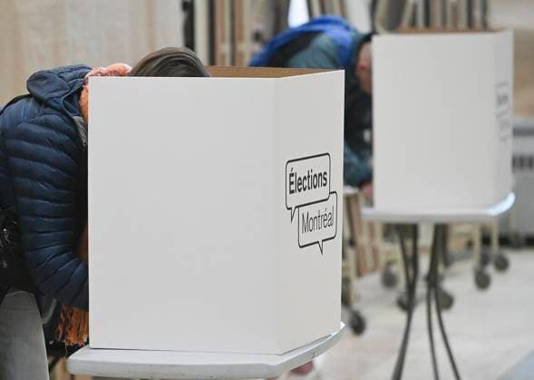 November 2, 2025, Montreal, Pq, Canada: People cast their ballots at a polling station on municipal election day in Montreal, Sunday, November 2, 2025. Montreal Canada  - ZUMAc35_ 20251102_zaf_c35_116 Copyright: xGrahamxHughesx