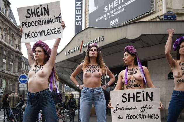 Protest Against Shein in Front of BHV Marais - Paris Femen activists hold placards reading Shein, unapologetic pedophile supplier - Shein official supplier of paedocriminals during a protest outside the BHV Le Marais store to denounce the opening of a boutique by Chinese brand Shein, accused of selling sex dolls modelled on children, in Paris, France, on November 3, 2025. Photo by Florian Poitout ABACAPRESS.COM Paris France  Copyright: xPoitoutxFlorian ABACAx