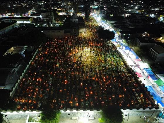 Aerial view of the San Andres Mixquic cemetery, located in Tlahuac, where people accompany their deceased loved ones in the traditional lighting ceremony on the Dia de Muertos celebration. on October 3, 2025 in Mexico City, Mexico. Mexico City Mexico - ZUMAe321 20251103_zia_e321_011 Copyright: xCarlosxSantiagox