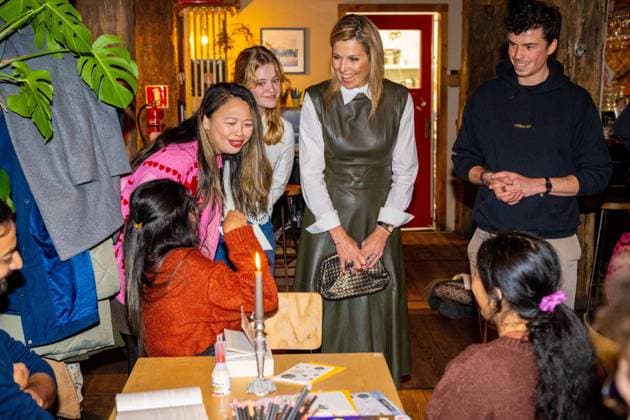 Amsterdam, The Netherlands, 2025-11-03 20:10:24 AMSTERDAM, 03-11-2025, The Offline Club. Queen Maxima during a visit to The Offline Club in Amsterdam. The Offline Club is a social enterprise focused on fostering genuine, personal connections in a time when screens and digital distractions are playing an increasingly important role. PHOTO: NLBeeld Patrick van Emst Credit: NL Beeld Patrick van Emst  Copyright: xx x