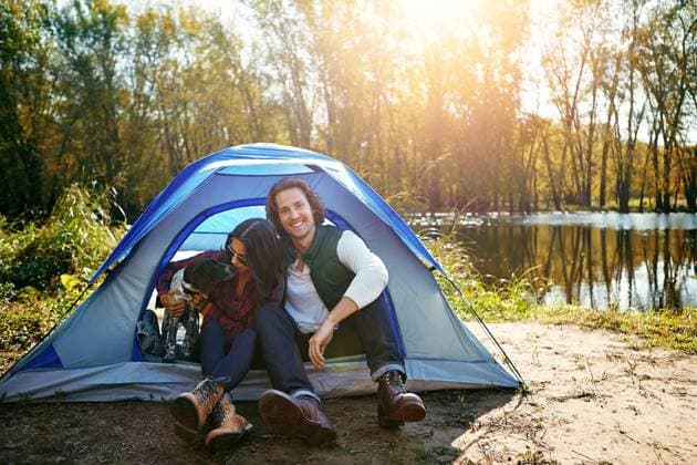 Couple, dog and camping by tent in nature for adventure, freedom and vacation or peace. People, puppy and relax in woods or forest by lake for summer holiday, memory and outdoor experience at morning Couple, dog and camping by tent in nature for adventure, freedom and vacation or peace. People, puppy and relax in woods or forest by lake for summer holiday, memory and outdoor experience at morning., model released, , 59827744.jpg RECORD DATE NOT STATED