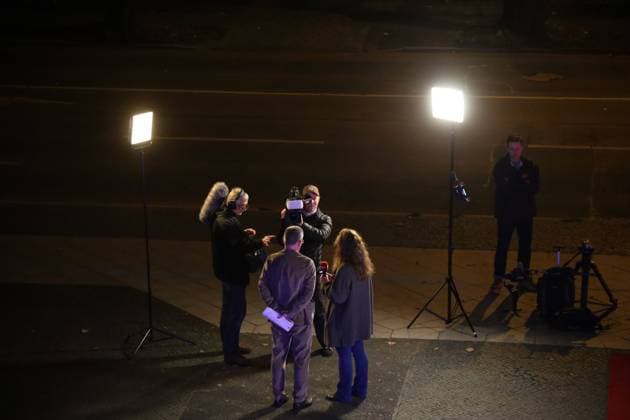 November 4, 2025, Cottbus, Brandenburg, Germany: Press attendees interview in front of the Staatstheater Cottbus ahead of the opening ceremony of the 35th FilmFestival Cottbus (FFC), one of the leading events dedicated to Eastern European cinema. The 2025 edition runs from November 4 to 9, presenting around 140 films from more than 40 countries. Held in Cottbus, a bilingual German-Sorbian city near the Polish border, the festival brings together filmmakers, industry representatives, and audiences to celebrate cultural diversity and promote Central and Eastern European cinema. Cottbus Germany - ZUMAf146 20251104_zip_f146_001 Copyright: xRouzbehxFouladix