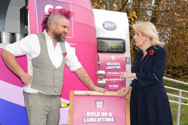 Community volunteering celebration Queen Camilla meets Spudman as he delivers jacket potatoes in a Royal Voluntary Service food truck, as she hosts members of the National Association of Care Catering (NACC), and representatives from Royal Voluntary Service (RVS) in a celebration of community volunteering during Meals on Wheels Week, at Clarence House in central London. Picture date: Wednesday November 5, 2025., Credit:Jordan Pettitt Avalon UK, London  Copyright: xJordanxPettittx xAvalonx 1050493383