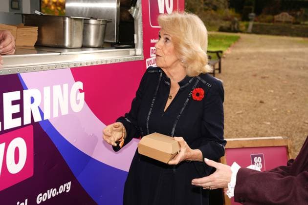 Community volunteering celebration Queen Camilla is served from Spudman as he delivers jacket potatoes in a Royal Voluntary Service food truck, as she hosts members of the National Association of Care Catering (NACC), and representatives from Royal Voluntary Service (RVS) in a celebration of community volunteering during Meals on Wheels Week, at Clarence House in central London. Picture date: Wednesday November 5, 2025., Credit:Jordan Pettitt Avalon UK, London  Copyright: xJordanxPettittx xAvalonx 1050498431