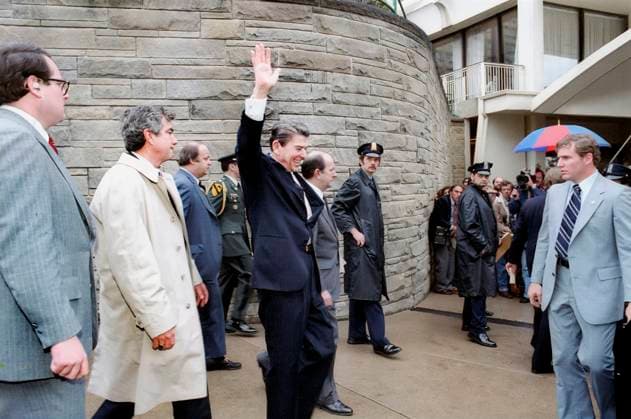 March 30, 1981, Washington, Dc, USA: U.S. President Ronald Reagan waving to crowd outside Hilton Hotel shortly before assassination attempt, Washington, D.C., USA, President Ronald Reagan White House Photographic Office, March 30, 1981 Washington USA - ZUMAg145 19810330_aza_g145_001 Copyright: xJTxVintagex