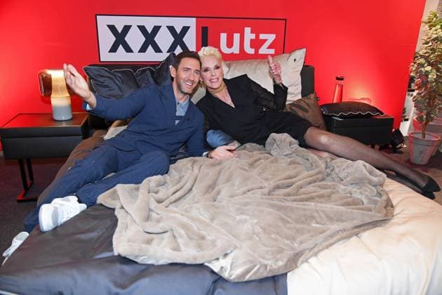 Marcel Remus, Brigitte Nielsen at the presentation of the Marcel Remus bedding collection Bedtime Stories in the premium furniture and furnishing store XXXLutz in Nuremberg on 05 11 2025