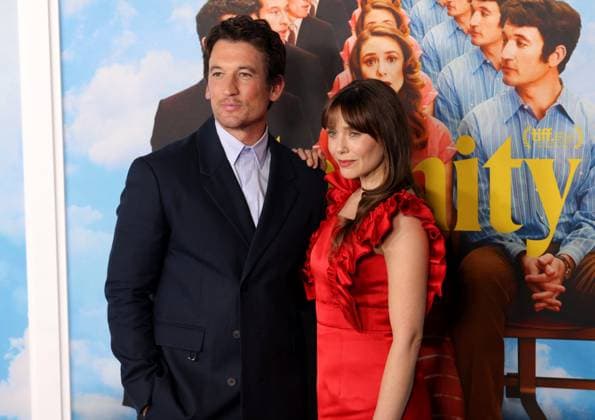 Miles Teller and Elizabeth Olsen attend the Los Angeles Special Screening of A24 s Eternity at the AMC Century City 15 in Los Angeles, CA on Wednesday, November 5, 2025. Storyline: In an afterlife where souls have one week to decide where to spend eternity, Joan is faced with the impossible choice between the man she spent her life with and her first love, who died young and has waited decades for her to arrive.  LAP20251105851 GREGxGRUDT