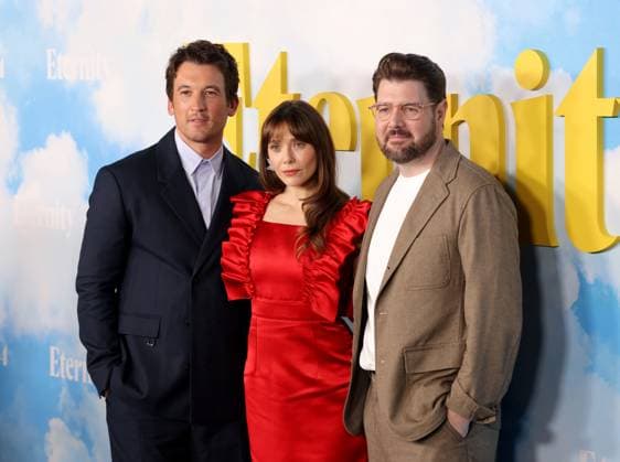 Miles Teller, Elizabeth Olsen and David Freyne attend the Los Angeles Special Screening of A24 s Eternity at the AMC Century City 15 in Los Angeles, CA on Wednesday, November 5, 2025. Storyline: In an afterlife where souls have one week to decide where to spend eternity, Joan is faced with the impossible choice between the man she spent her life with and her first love, who died young and has waited decades for her to arrive.  LAP20251105852 GREGxGRUDT