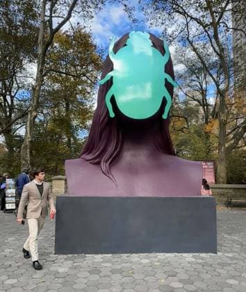 November 6, 2025, New York, New York, USA: A view of the public sculpture First Sun by Kuwaiti artist Monira Al Qadiri seen on display in Central Park, at the Doris C. Freedman Plaza. The 17-foot-tall painted aluminum sculpture is inspired by the ancient Egyptian deity Khepri reimaged as a contemporary monument. New York USA - ZUMAk03_ 20251106_zaf_k03_052 Copyright: xNancyxKaszermanx
