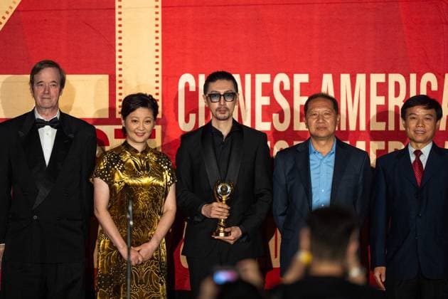 LOS ANGELES, CA - NOVEMBER 06: Actress Xu Fan (L2) looks on as Edward Zhang Ruyi (R3) receives Best Actor award during the Golden Angel Awards Ceremony of the 2025 Chinese American Film Festival (CAFF) and the Chinese American Television Festival (CATF) on November 6, 2025 in Los Angeles, California.  Copyright: xVCGx 111602455485
