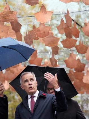 November 7, 2025, Toronto, On, CANADA: Prime Minister Mark Carney walks under an installation of copper maple leaf sculptures tours the Harbourfront Centre in Toronto, Friday, Nov. 7, 2025. Toronto CANADA  - ZUMAc35_ 20251107_zaf_c35_022 Copyright: xNathanxDenettex