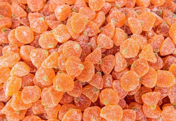 Sweet assortment of sugar coated fruit gummies A delightful heap of sugar-coated fruit gummies shaped like pumpkins, invoking a sense of playful sweetness. Vibrant orange and green hues enhance their visual appeal. Model Released MarinaMos_ID32180_1095547_006 Copyright: xMarinaxMosx RECORD DATE NOT STATED