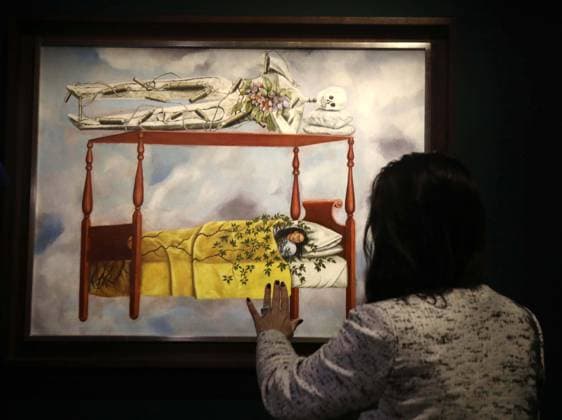 November 7, 2025, New York, New York, USA: A woman seen with El sueno (La cama) 1940 by artist Frida Kahlo, estimate $40 million - $60 million, during November Marquee Week 2025 during SothebyÃ¢â‚¬â ¢s Opening of the New Global Headquarters at the Breuer. New York USA - ZUMAk03_ 20251107_zaf_k03_045 Copyright: xNancyxKaszermanx