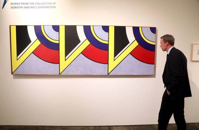 November 7, 2025, New York, New York, USA: A woman seen with Modern Painting Triptych II, 1967, by artist Roy Lichtenstein, estimate $3.5 million - $4.5 million, during November Marquee Week 2025 during SothebyÃ¢â‚¬â ¢s Opening of the New Global Headquarters at the Breuer. New York USA - ZUMAk03_ 20251107_zaf_k03_091 Copyright: xNancyxKaszermanx