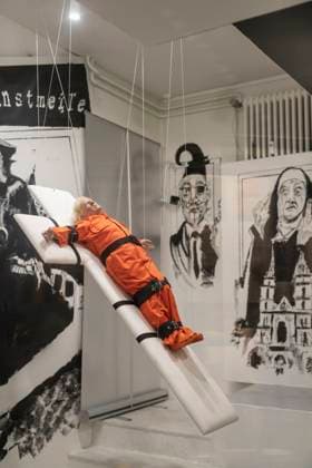 November 8, 2025, Basel, Basel-Stadt, Switzerland: A sculpture depicting the US President Donald Trump in a prisoner orange jumpsuit and strapped to a cross looking like a death row strapped-down bed, is displayed in a gallery of the city centre of Basel, Switzerland Basel Switzerland - ZUMAp199 20251108_zip_p199_003 Copyright: xMatteoxPlacuccix
