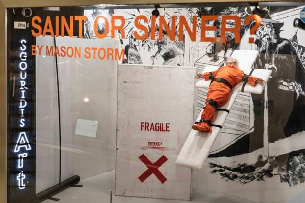 November 8, 2025, Basel, Basel-Stadt, Switzerland: A sculpture depicting the US President Donald Trump in a prisoner orange jumpsuit and strapped to a cross looking like a death row strapped-down bed, is displayed in a gallery of the city centre of Basel, Switzerland Basel Switzerland - ZUMAp199 20251108_zip_p199_006 Copyright: xMatteoxPlacuccix