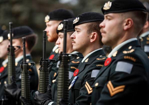 November 9, 2025, Calgary, Ab, CANADA: Members of the KingöÄÃ s Own Calgary Regiment present arms during a graveside ceremony honouring Cpl. Gawen Foster, who served with the 50th Canadian Infantry Battalion, Canadian Expeditionary Force, during the First World War, in Calgary, Sunday, Nov. 9, 2025. Calgary CANADA  - ZUMAc35_ 20251109_zaf_c35_028 Copyright: xJeffxMcintoshx