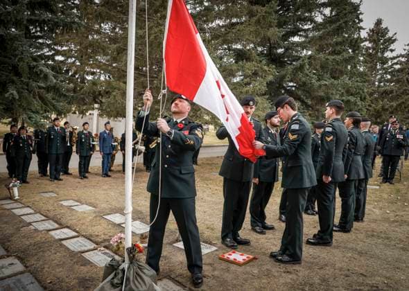 November 9, 2025, Calgary, Ab, CANADA: Members of the KingöÄÃ s Own Calgary Regiment lower a Canadian flag during a graveside ceremony honouring Cpl. Gawen Foster, who served with the 50th Canadian Infantry Battalion, Canadian Expeditionary Force, during the First World War, in Calgary, Sunday, Nov. 9, 2025. Calgary CANADA  - ZUMAc35_ 20251109_zaf_c35_029 Copyright: xJeffxMcintoshx