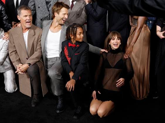 Josh Brolin, Glen Powell, Angelo Giorgio Gray and Emilia Jones react as they kneel for a group photo when they arrive on the red carpet at Paramount s The Running Man New York Premiere at AMC Lincoln Square Theater on Sunday, November 9, 2025 in New York City.  NYP20251109130 JOHNxANGELILLO