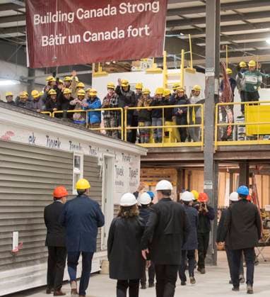 November 10, 2025, Fredericton, Nb, Canada: Workers smile and wave at Prime Minister Mark Carney while taking a tour of Maple Leaf Homes in Fredericton, N.B., on Monday, Nov. 10, 2025. Fredericton Canada  - ZUMAc35_ 20251110_zaf_c35_052 Copyright: xStephenxMacgillivrayx