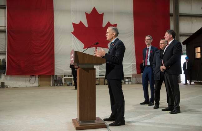 November 10, 2025, Fredericton, Nb, Canada: Prime Minister Mark Carney makes an announcement at the manufacturing facility of Maple Leaf Homes in Fredericton, N.B., on Monday, Nov. 10, 2025. Behind Carney from left are: David Myles, MP for Fredericton-Oromocto, Wayne Long, MP for Saint-John-Kennebecasis, and Dominic LeBlanc, MP for Beauso jour. Fredericton Canada - ZUMAc35_ 20251110_zaf_c35_055 Copyright: xStephenxMacgillivrayx