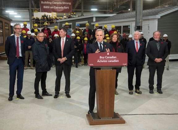 November 10, 2025, Fredericton, Nb, Canada: Prime Minister Mark Carney makes an announcement at the manufacturing facility of Maple Leaf Homes in Fredericton, N.B., on Monday, Nov. 10, 2025. Behind Carney from left are: David Myles, MP for Fredericton-Oromocto, Wayne Long, MP for Saint-John-Kennebecasis, Dominic LeBlanc, MP for Beauso jour, Erika Jones, president of Maple Leaf Homes, Bill Jones, chairman, and Chris McLean, general manager. Fredericton Canada - ZUMAc35_ 20251110_zaf_c35_056 Copyright: xStephenxMacgillivrayx