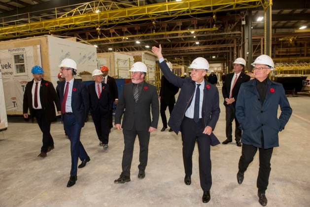 November 10, 2025, Fredericton, Nb, Canada: Prime Minister Mark Carney waves at workers while being taken on a tour of the manufacturing facility of Maple Leaf Homes by Chris McLean, general manager, center, in Fredericton, N.B., on Monday, Nov. 10, 2025. Fredericton Canada - ZUMAc35_ 20251110_zaf_c35_057 Copyright: xStephenxMacgillivrayx