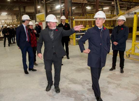 November 10, 2025, Fredericton, Nb, Canada: Prime Minister Mark Carney second from right, is taken on a tour of the manufacturing facility of Maple Leaf Homes by Chris McLean, general manager, center, in Fredericton, N.B., on Monday, Nov. 10, 2025. Fredericton Canada - ZUMAc35_ 20251110_zaf_c35_058 Copyright: xStephenxMacgillivrayx