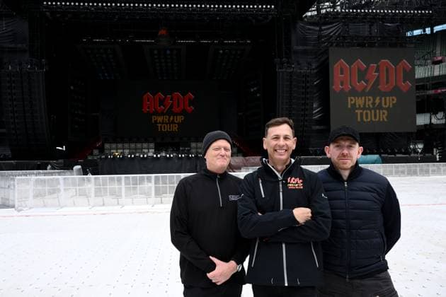 ACDC CONCERT STAGING, (L-R) Roadie Dale Skjerseth, Australian promoter Christo Van Egmond and AC DC head of production Will Keating pose for a photo with staging ahead of a concert by Australian rock band AC DC at the MCG, in Melbourne, Tuesday, November 11, 2025. ( NO ARCHIVING MELBOURNE VICTORIA AUSTRALIA  Copyright: xJOELxCARRETTx 20251111191125579945