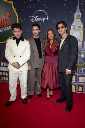 November 10, 2025, New York, United States: (L-R) Nick Jonas, Kevin Jonas, Ayo Davis and Joe Jonas attend Disney+ s A Very Jonas Christmas Movie New York Premiere at New York City Center. New York United States - ZUMAs197 20251110_aaa_s197_403 Copyright: xRonxAdarx