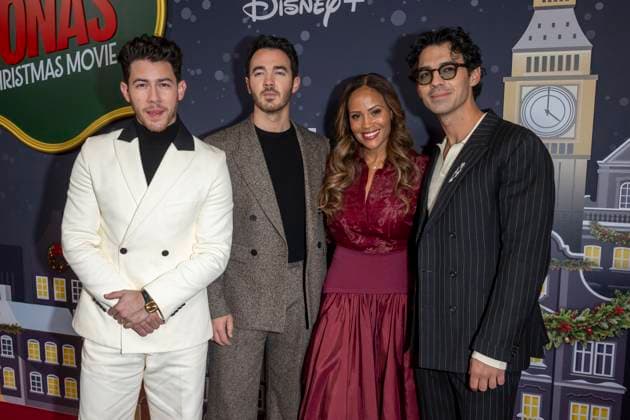 November 10, 2025, New York, United States: (L-R) Nick Jonas, Kevin Jonas, Ayo Davis and Joe Jonas attend Disney+ s A Very Jonas Christmas Movie New York Premiere at New York City Center. New York United States - ZUMAs197 20251110_aaa_s197_404 Copyright: xRonxAdarx