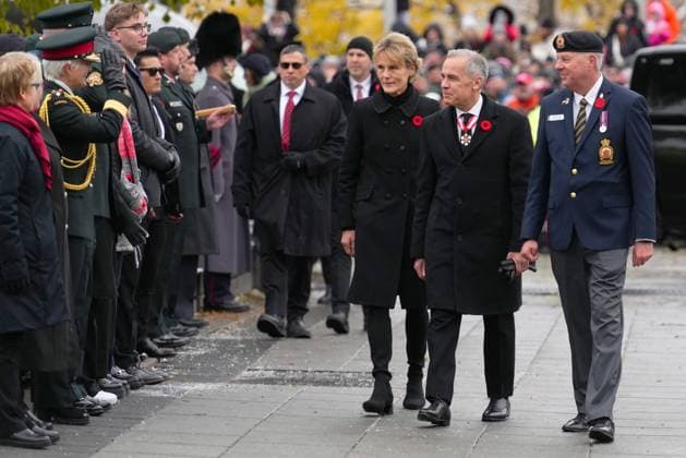November 11, 2025, Ottawa, On, Canada: Prime Minister Mark Carney and his wife Diana Fox Carney arrives for a Remembrance Day ceremony in Ottawa on Tuesday, Nov. 11, 2025. Ottawa Canada  - ZUMAc35_ 20251111_zaf_c35_015 Copyright: xSeanxKilpatrickx
