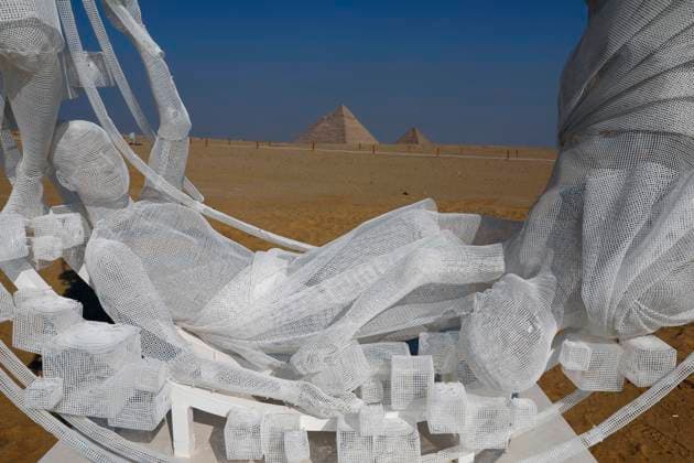 (251111) -- CAIRO, Nov. 11, 2025 -- An artistic installation is displayed during the Forever Is Now international art exhibition at Giza Pyramids scenic spot in Giza, Egypt, Nov. 11, 2025. The fifth edition of Forever Is Now international art exhibition on Tuesday kicked off in the area of Egypt s Giza Pyramids scenic spot, showcasing 10 artworks of artists from different countries. The exhibition runs from Nov. 11 to Dec. 6. Ahmed Gomaa) EGYPT-GIZA-PYRAMIDS-ART EXHIBITION-FOREVER IS NOW AixHamaide¡¤gema 