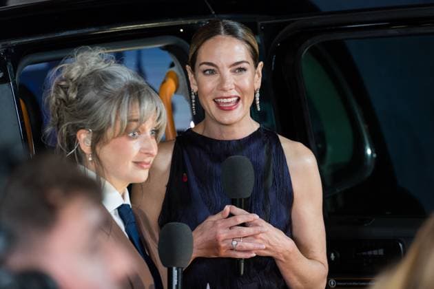 November 11, 2025, London, England, United Kingdom: MICHELLE MONAGHAN gives an interview as she attends the World Premiere of The Family Plan 2 at Curzon Mayfair in London. London United Kingdom - ZUMAs371 20251111_zip_s371_040 Copyright: xWiktorxSzymanowiczx