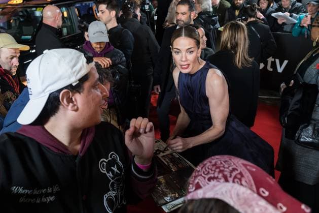November 11, 2025, London, England, United Kingdom: MICHELLE MONAGHAN poses for a selfie with a fan as she attends the World Premiere of The Family Plan 2 at Curzon Mayfair in London. London United Kingdom - ZUMAs371 20251111_zip_s371_055 Copyright: xWiktorxSzymanowiczx