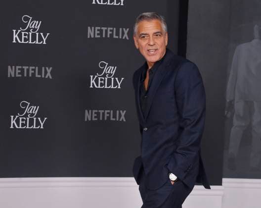 Cast member George Clooney attends the premiere of Netflix s dramatic comedy Jay Kelly at the Egyptian Theatre in the Hollywood section of Los Angeles on Tuesday, November 11, 2025. Storyline: Famous movie actor Jay Kelly embarks on a journey of self-discovery, confronting his past and present with his devoted manager Ron. Poignant and humor-filled, pitched at the intersection of regrets and glories.  LAP2025111101 JIMxRUYMEN
