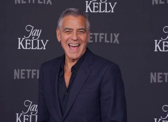 Cast member George Clooney attends the premiere of Netflix s dramatic comedy Jay Kelly at the Egyptian Theatre in the Hollywood section of Los Angeles on Tuesday, November 11, 2025. Storyline: Famous movie actor Jay Kelly embarks on a journey of self-discovery, confronting his past and present with his devoted manager Ron. Poignant and humor-filled, pitched at the intersection of regrets and glories.  LAP2025111102 JIMxRUYMEN