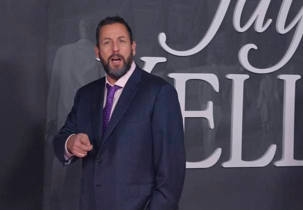 Cast member Adam Sandler attends the premiere of Netflix s dramatic comedy Jay Kelly at the Egyptian Theatre in the Hollywood section of Los Angeles on Tuesday, November 11, 2025. Storyline: Famous movie actor Jay Kelly embarks on a journey of self-discovery, confronting his past and present with his devoted manager Ron. Poignant and humor-filled, pitched at the intersection of regrets and glories.  LAP2025111109 JIMxRUYMEN
