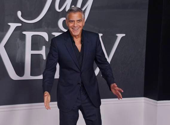 Cast member George Clooney attends the premiere of Netflix s dramatic comedy Jay Kelly at the Egyptian Theatre in the Hollywood section of Los Angeles on Tuesday, November 11, 2025. Storyline: Famous movie actor Jay Kelly embarks on a journey of self-discovery, confronting his past and present with his devoted manager Ron. Poignant and humor-filled, pitched at the intersection of regrets and glories.  LAP2025111113 JIMxRUYMEN