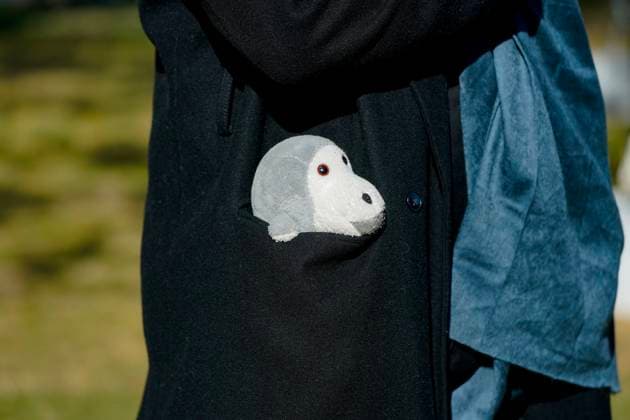 An attendees carries a stuffed animal in honor of Dr. Jane Goodall, DBE during the celebration of life ceremony at the National Cathedral on Wednesday, November 12, 2025 in Washington DC.  WAP20251112916 LeighxVogel