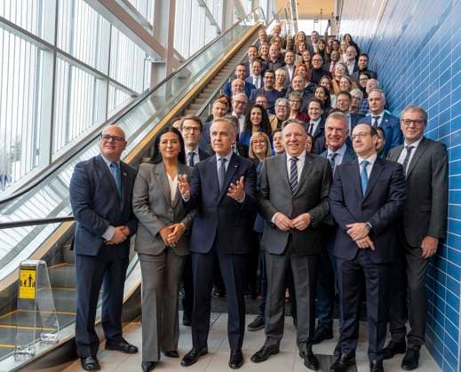 November 14, 2025, Deux-Montagnes, Pq, CANADA: Prime Minister Mark Carney, centre flanked by Montreal mayor Soraya Martinez Ferrada, left and Quebec Premier Francois Legault, right, pose with VIP s as they arrive at the Deux-Montagnes station following their inaugural ride of the REM light rail system connecting McGill station in downtown Montreal to Deux-Montagnes, Quebec in Deux-Montagnes, Que., on Friday, Nov. 14, 2025. Deux-Montagnes CANADA - ZUMAc35_ 20251114_zaf_c35_015 Copyright: xChristinnexMuschix