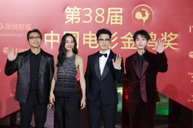 XIAMEN, CHINA - NOVEMBER 15: (L-R) Director Sam Quah, actress Ning Chang, actor Huang Xiaoming and actor Peng Yuchang of The Fire Raven arrive at the red carpet for the closing ceremony during the 38th China Golden Rooster Awards on November 15, 2025 in Xiamen, Fujian Province of China.  Copyright: xVCGx 111604072199